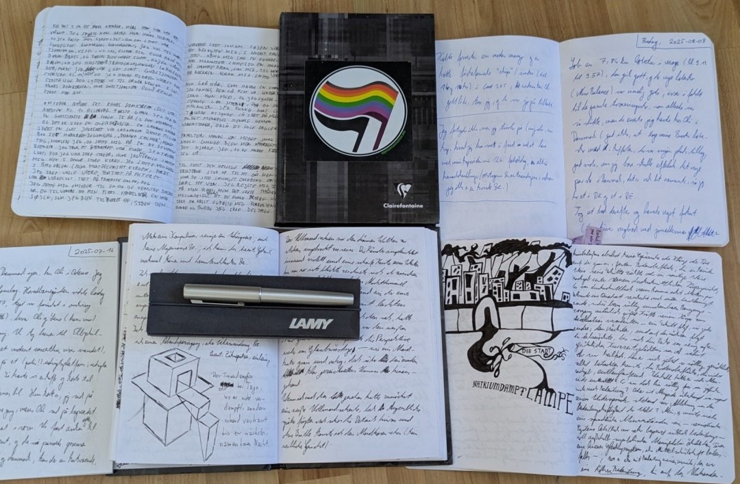 Handwritten notebooks with some doodles. Mostly cursive