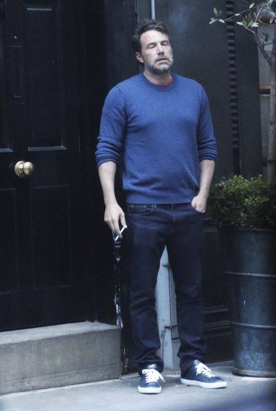 the picture of ben affleck smoking a cigarette and looking completely worn out which launched a thousand image macros.