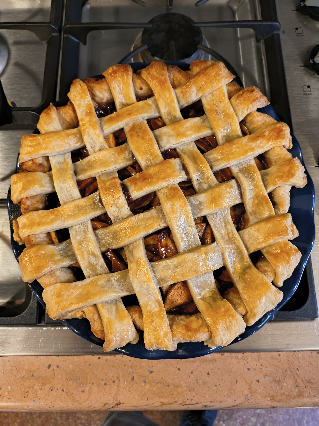 Top-down view of a freshly baked apple pie with a lattice top