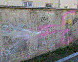 graffito on a wall of a pink ejaculating penis; line drawing