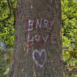 tree with graffito saying 'nb-love', dithered with FloydSteinberg dithering and remapped to netscape colors; leaves in the background