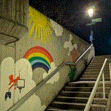 concrete stairs with rainbow graffito/mural
