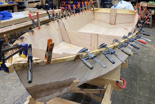 Photo of the gunwales with lots of clamps