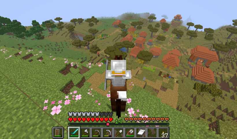 a village as seen from a hill, fruit riding horse