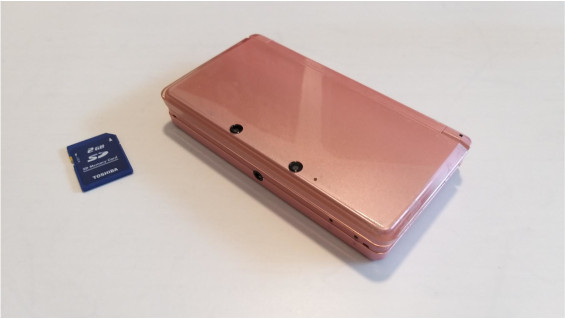 A pink 3DS and an SD card