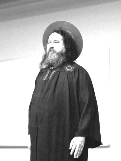 A greyscale picture of Richard Stallman, dressed as Saint IGNUcius