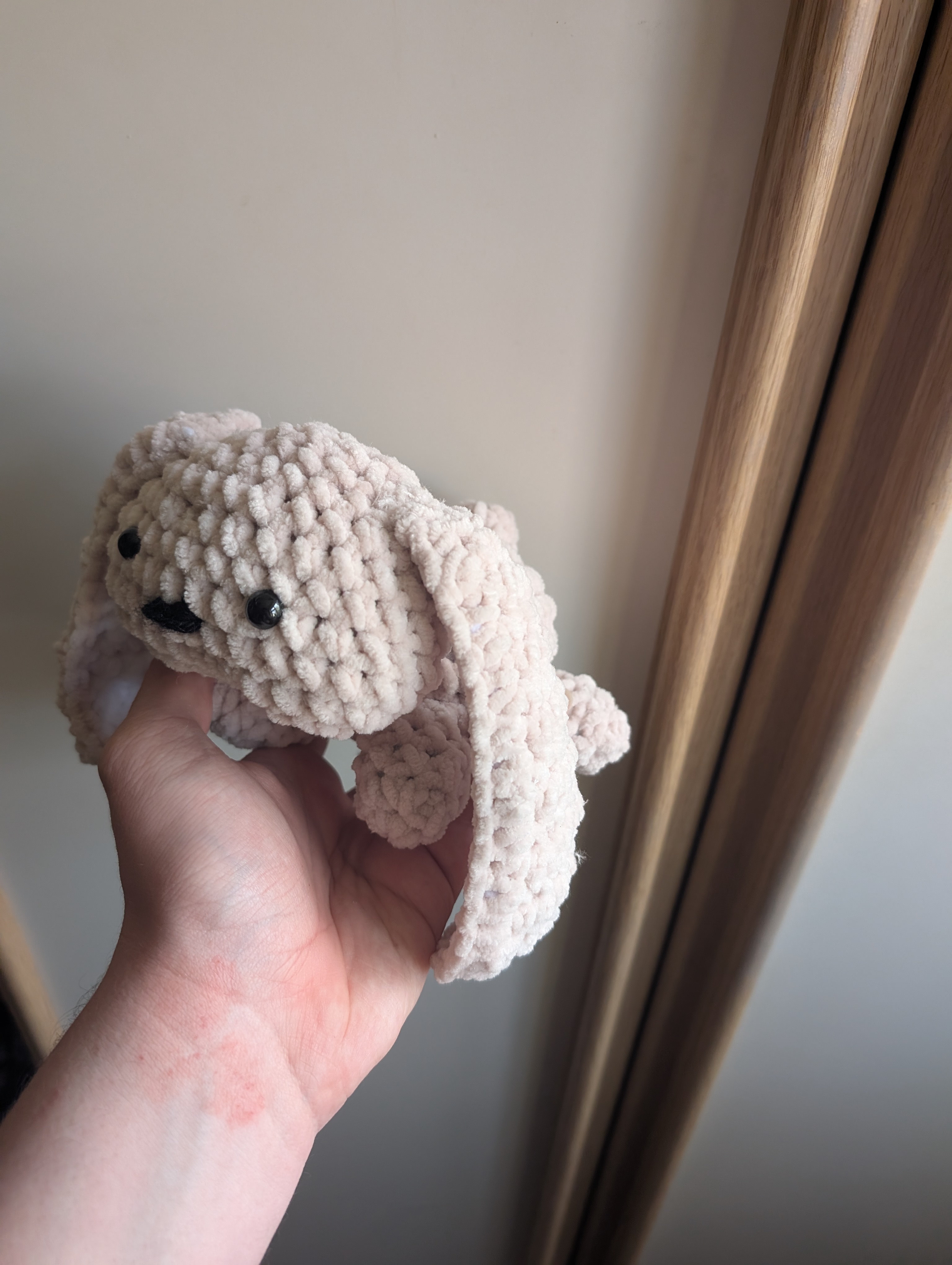 Side view of a crocheted 
bunny