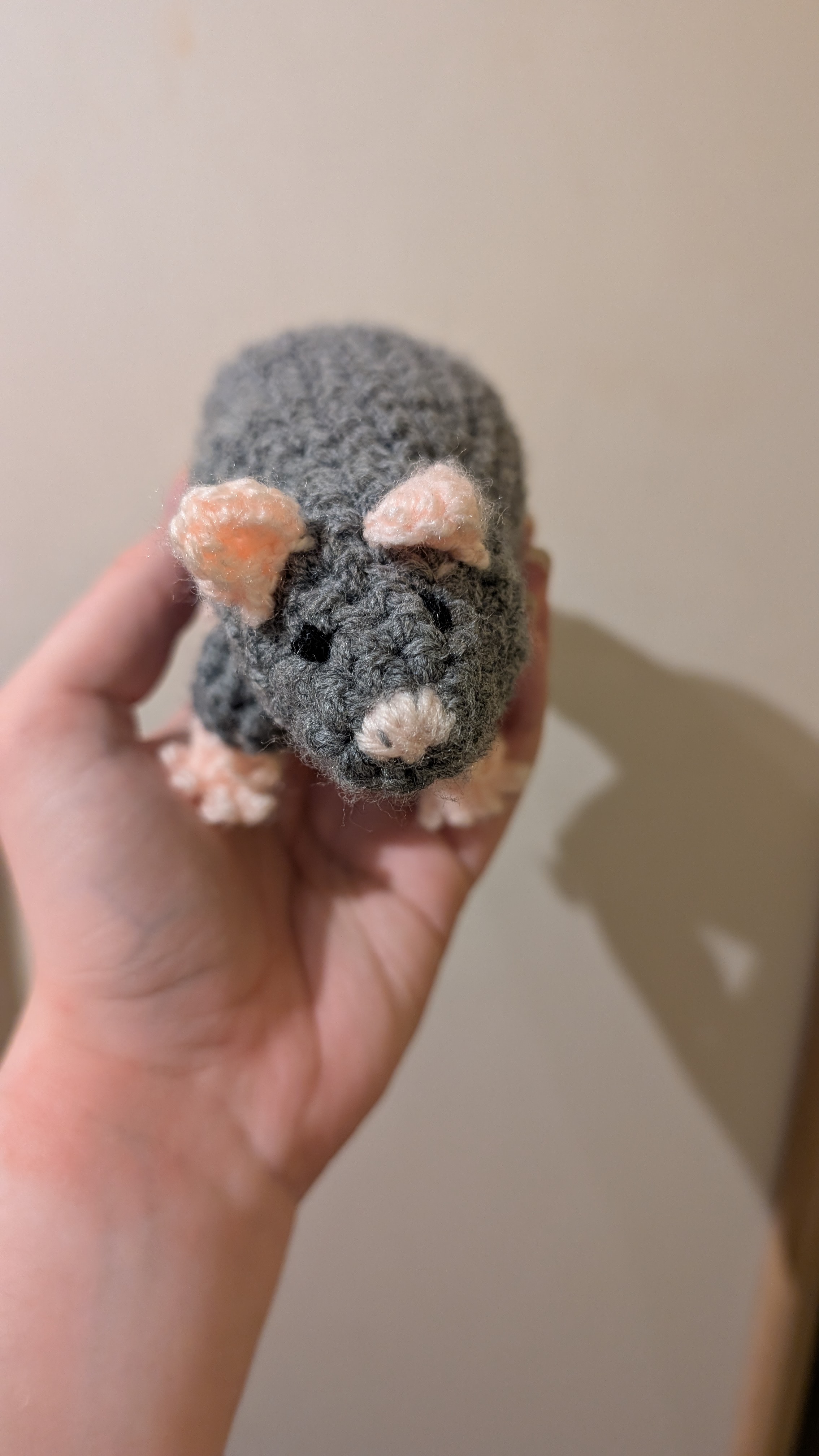 Front view of a crocheted 
rat