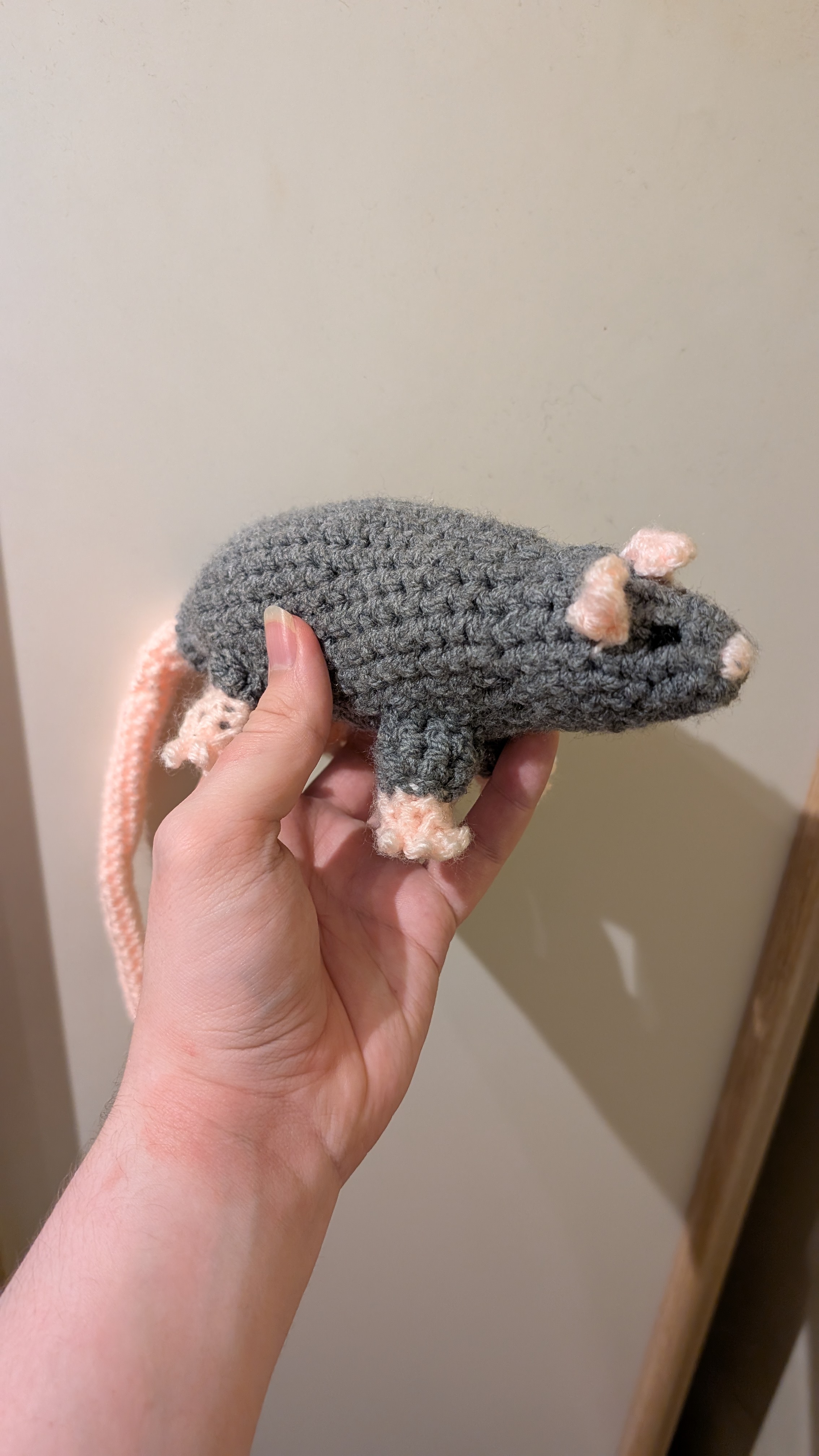 Side view of a crocheted 
rat